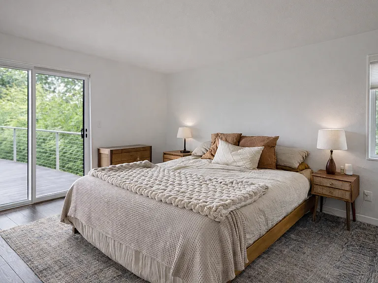 view of trees and mountains from master bedroom