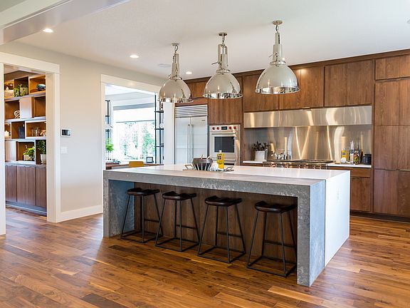 Gourmet kitchen with countertop seating at the island
