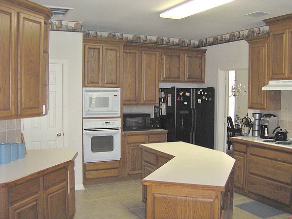 Large island and lots of cabinets.