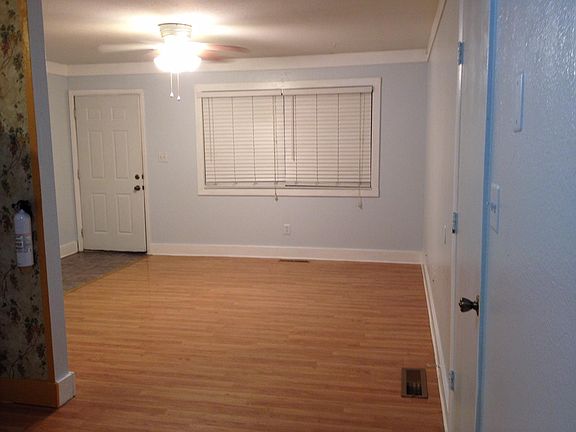 View of Living room from the dining area. Hidden from these photos are the front coat closet, the water heater closet, the forced-air gas furnace closet and the linen closet.