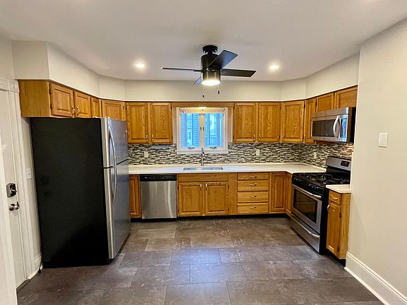 Kitchen - New vinyl flooring, quartz countertops, deep sink, recessed lighting, ceiling fan