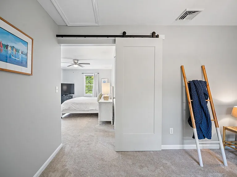 Sitting room off of primary bedroom has a trundle bed that can sleep 2 additional people in twin beds.