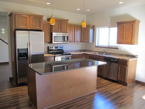 Kitchen - maple cabinets, laminate floor