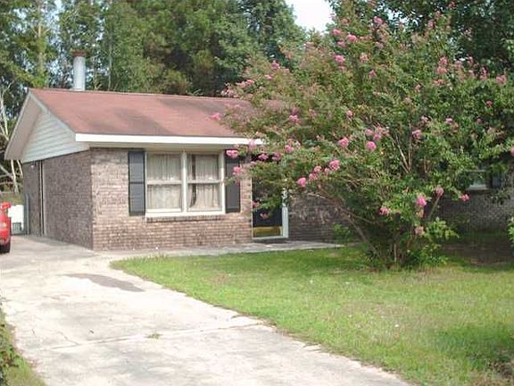 Current photo of home in summer.