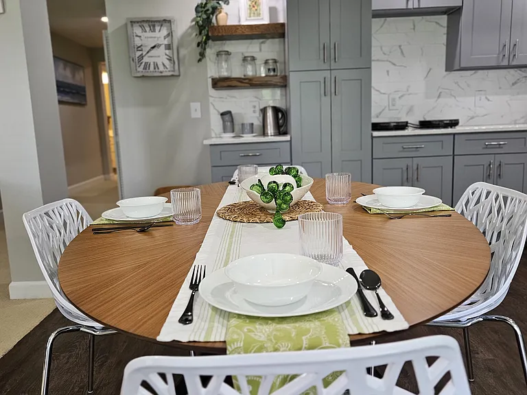 Modern oval dining table that comfortably seats 4.
