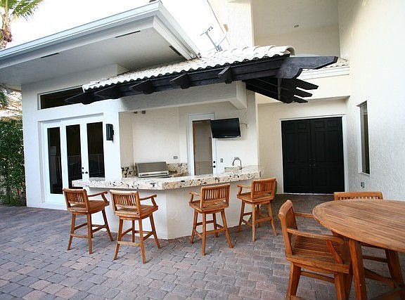 Granite bar with infrared grill, refrig & flat screen