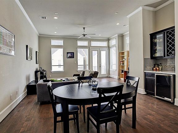 Dining area has built-in custom dry bar with beverage cooler and wine storage. Great for entertaining!