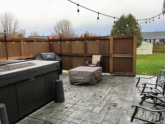Recently added private fenced in area w/ gorgeous stamped concrete