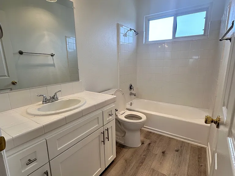 White shaker cabinets with the white quartz countertops.