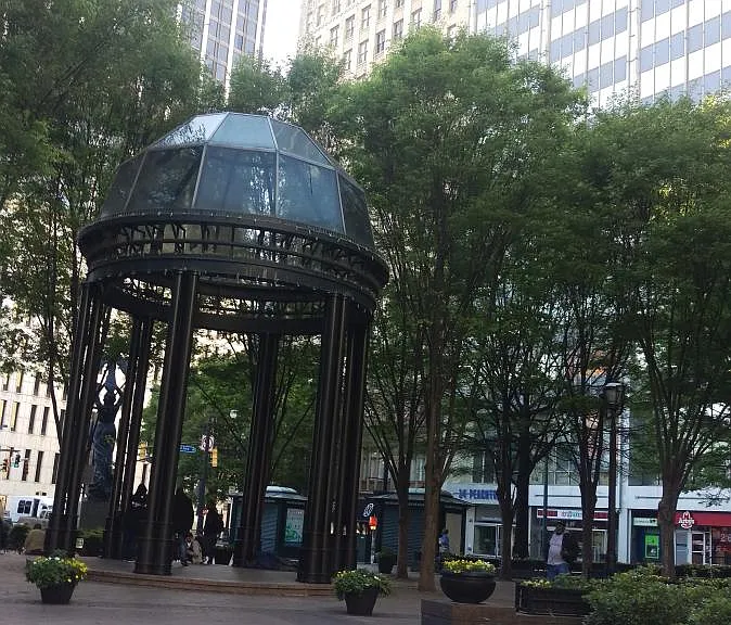 Building peeks over a gazebo in scenic Woodruff Park across