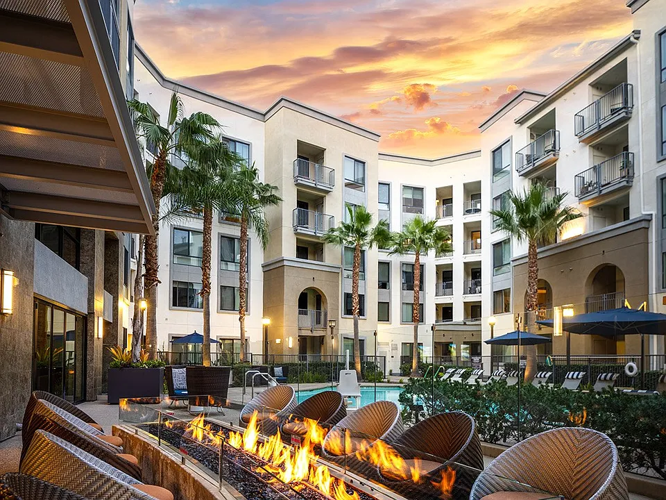 Poolside courtyard with fire pits and seating