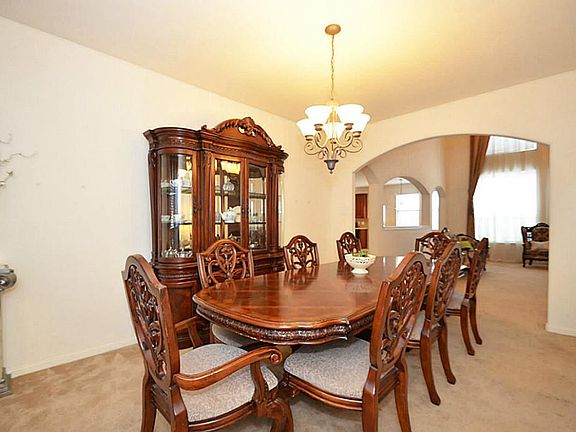 Formal Dining open to two story Family Room.