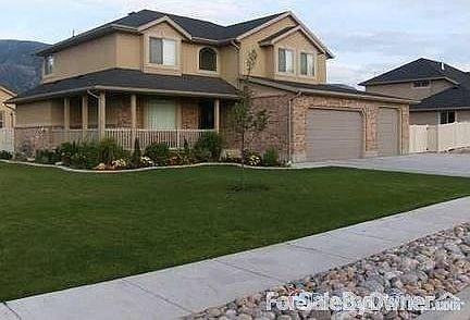 Outside View : Landscaped beautiful yard, huge garage, large driveway.
