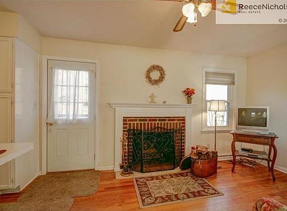 Kitchen opens to hearth room with fireplace