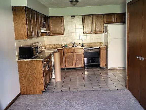 Kitchen from the dining area which leads to the french doors that open to the patio
