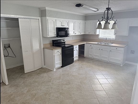 Stove, dishwasher, refrigerator, and washer/dryer hookups