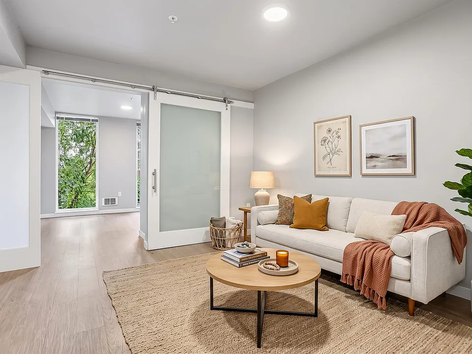 A frosted sliding door lets you open the bedroom to the living room or close it off.