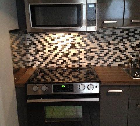 Kitchen with stove and microwave