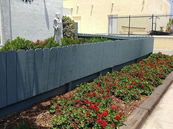 Red Geraniums Give Curb Appeal