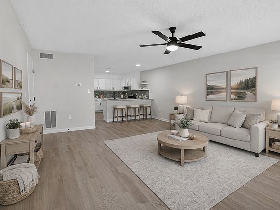 Large open floorplan with upgraded flooring throughout