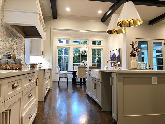 Exquisite kitchen open to bright dining room and living room.