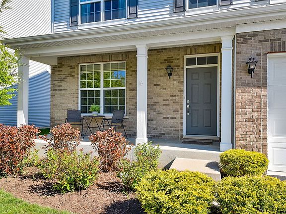 Enjoy coffee and views of the Nature Preserve across the street from your front porch