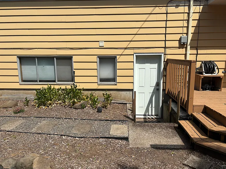 Laundry room entrance with keycode off the back. Great private entrance to downstairs and kitchenette.