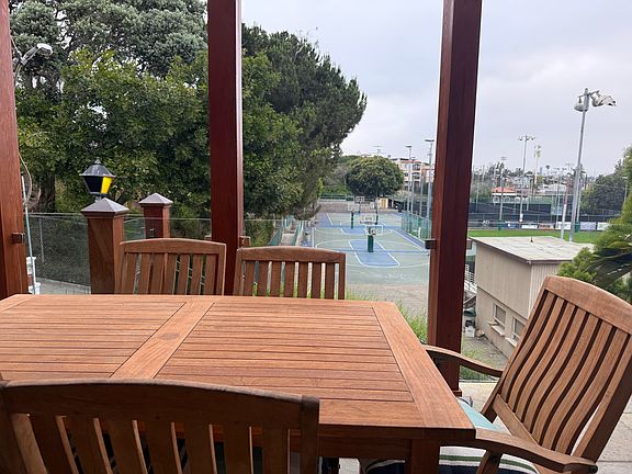 Overlooking Live Oak Park. Sip a glass of wine while the kids shoot hoops