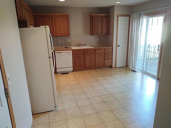 Kitchen with eating area, pantry, and door to deck