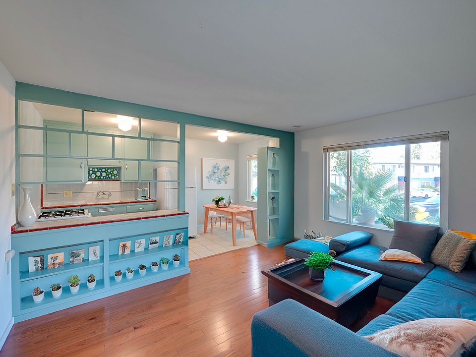 Bright and cool living room with 60's Mod original design, Opens to Kitchen and nook.