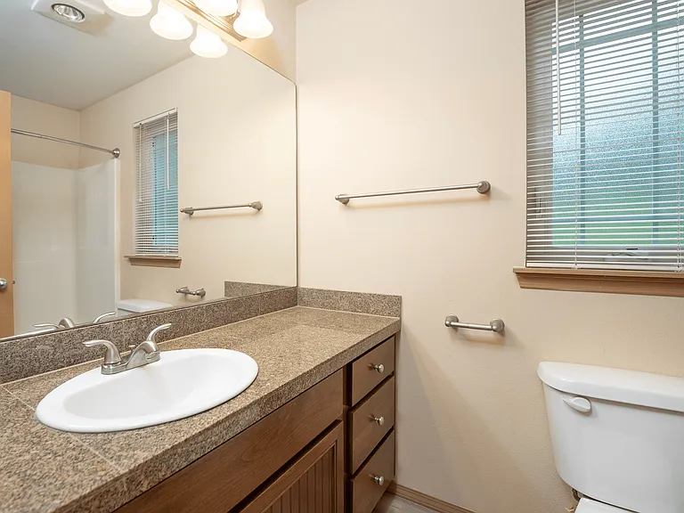 Sleek and sophisticated! This bathroom showcases rich dark wood cabinetry paired with modern countertops for a timeless, elegant look. The perfect blend of style and function! #BathroomGoals #ModernLiving Sleek and sophisticated! This bathroom showcases r