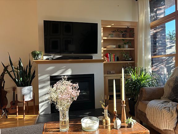 Mounted 55" TV above gas fireplace.