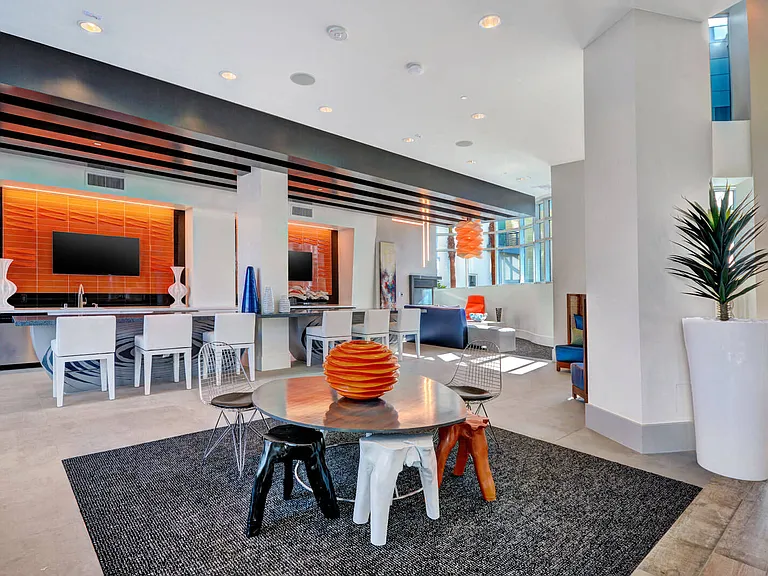 Large screen TVs and entertaining bar in the community club house