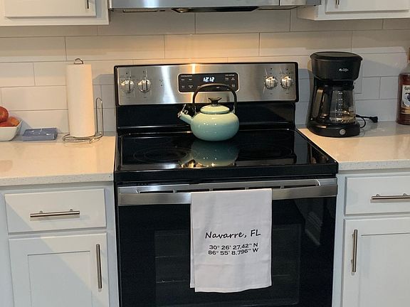 All new appliances with glass cooktop, coffee maker, microwave, dishwasher, ice maker/fridge. Cookware/dinnerware/silverware.
