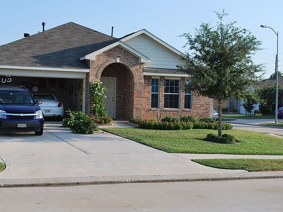 Corner lot, 3-sides brick, double garage.