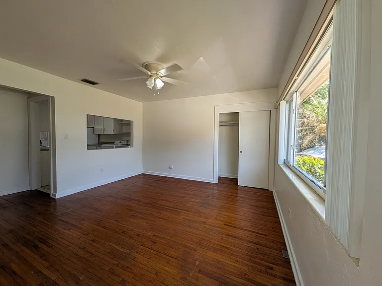 The living room is to your right when you enter the apartment. It has a large storage closet