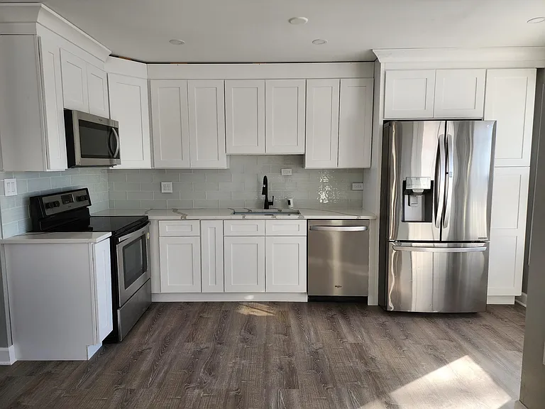 Second Floor: Spacious, Bright Kitchen with door to porch.