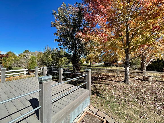Beautiful greenbelt view and colorful, mature trees from the backyard deck
