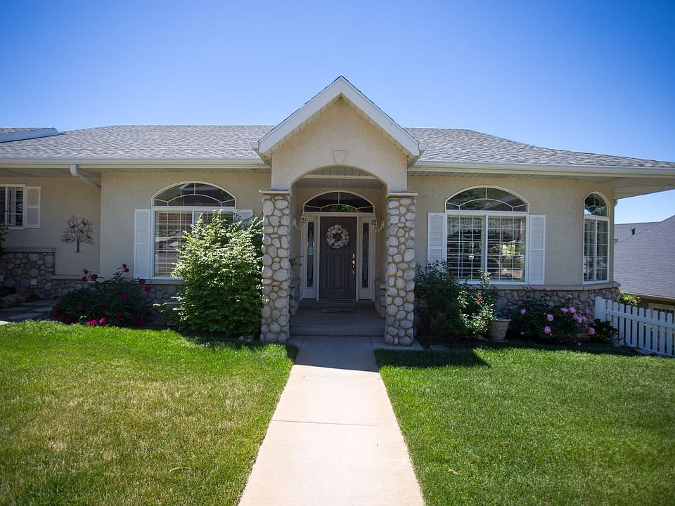 Street view of the house. Entrance to the second level of the house around the side of the house in next picture.