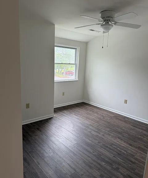 2nd Bedroom with new flooring, fan, window and freshly painted