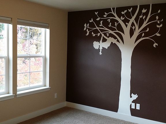 One of the bedrooms with hand painted mural