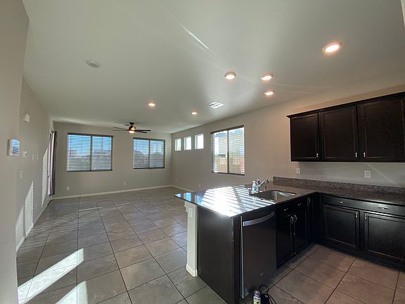 View upon entering home, kitchen is on the right with open floor plan to living and dinning areas