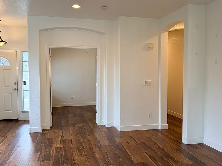 Living room looking towards 3rd bedroom/ den and front door