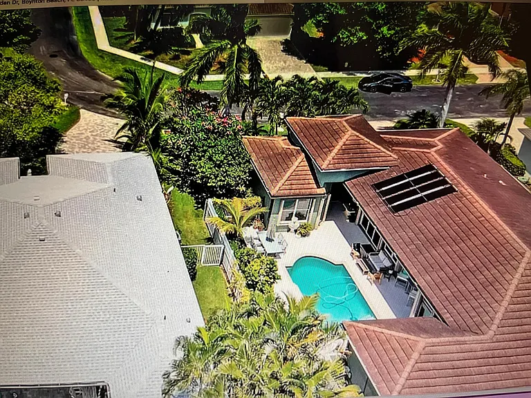 Aerial view of house prior to new roof and exterior paint.