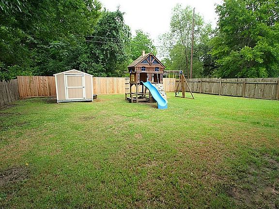 LARGE BACKYARD WITH 10x10 STORAGE SHED. SWINGSET CAN STAY OR GO!