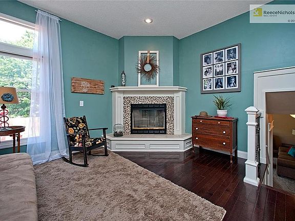 Hearth Room with Fireplace (Designer Glass Mosaic Tile) and Hickory Floors