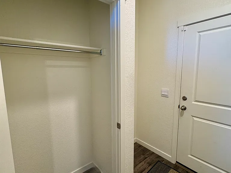 Closet, door to the garage