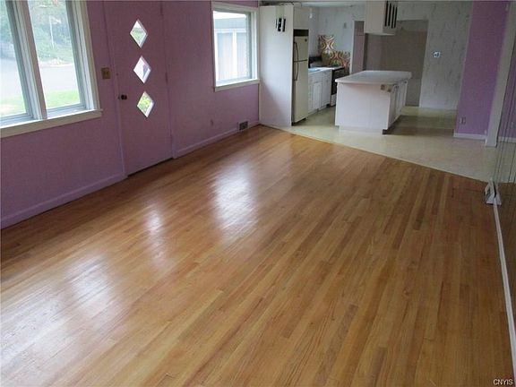 Apartment one has an open floor plan with kitchen flowing into the living room.