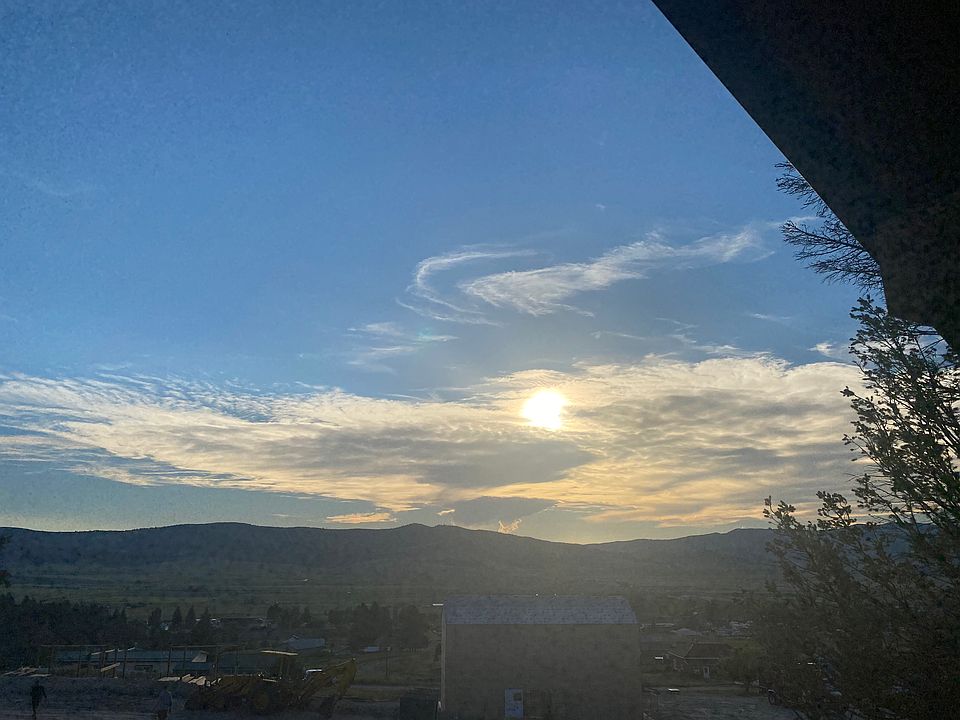 Enjoy beautiful sunsets from the porch. More pictures to come of the inside.