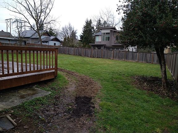Large fenced back yard with nice sized deck for entertaining